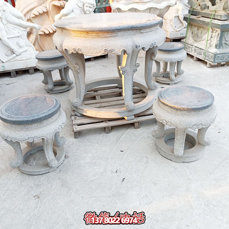 古典風(fēng)情石材庭院環(huán)形石桌石凳套裝 古典風(fēng)情石材庭院環(huán)形石桌石凳套裝